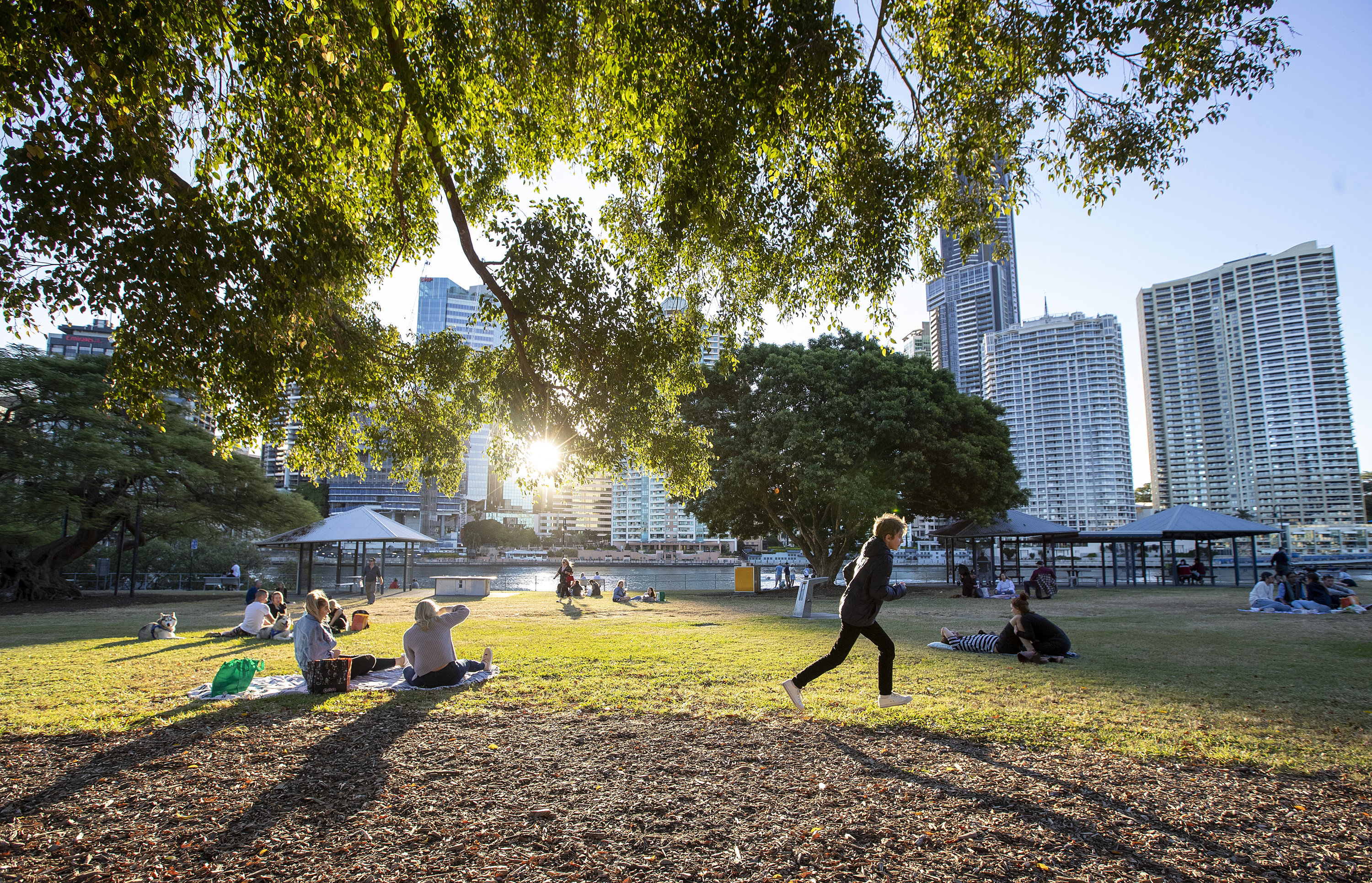 Queenslanders are being urged to continue practicing social distancing as some coronavirus measures are rolled back.