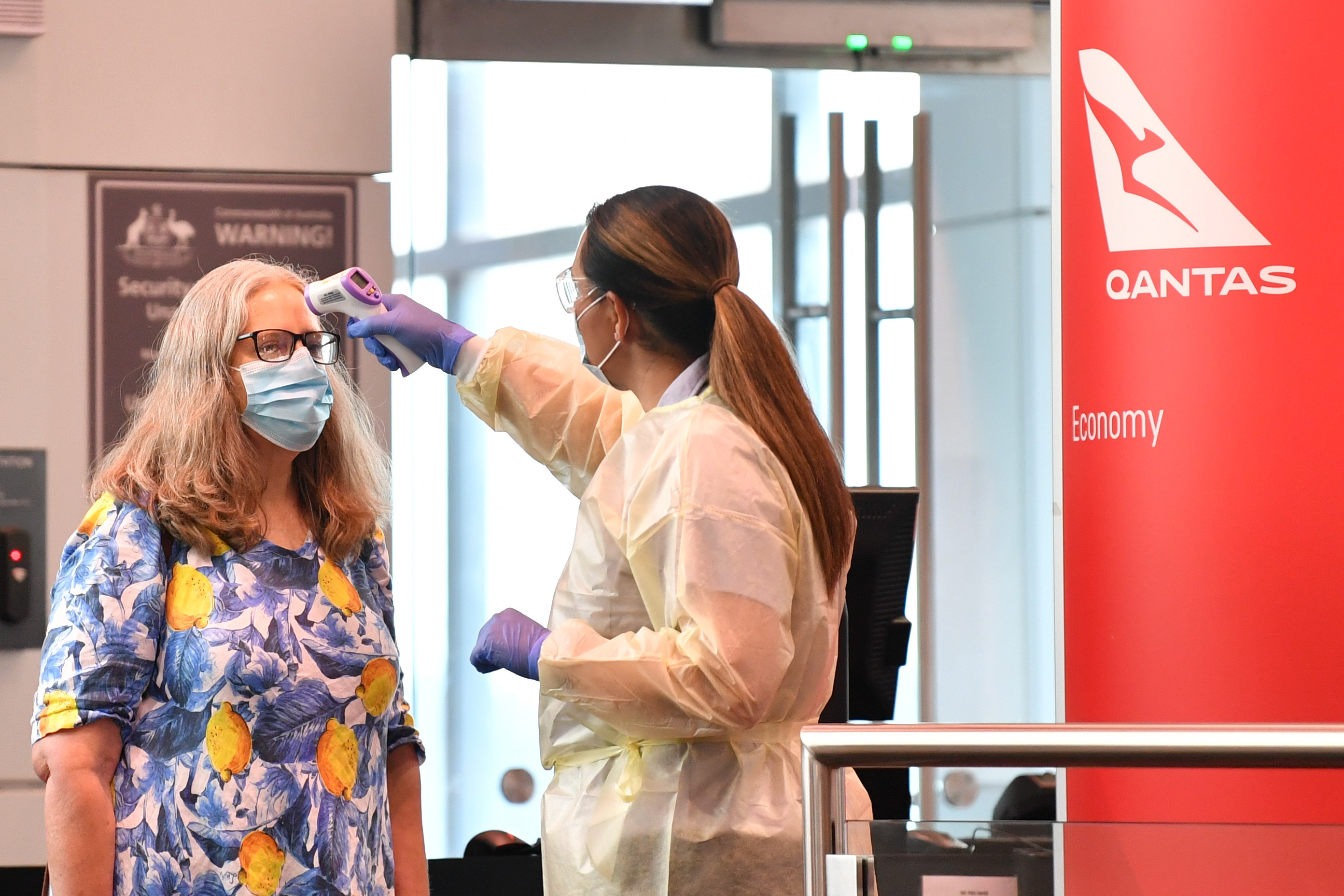 With the first passengers from Melbourne arriving in Sydney passengers on a flight from Canberra are tested for COVID-19 symptoms