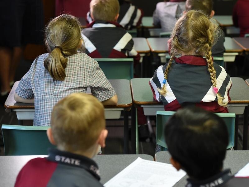 Children sit in a classroom