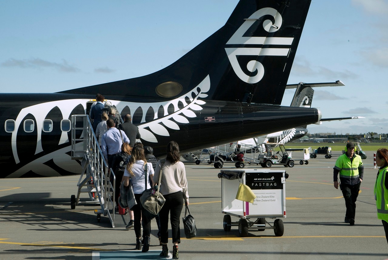 Passengers board an Air New Zealand flight at Christchurch Airport.