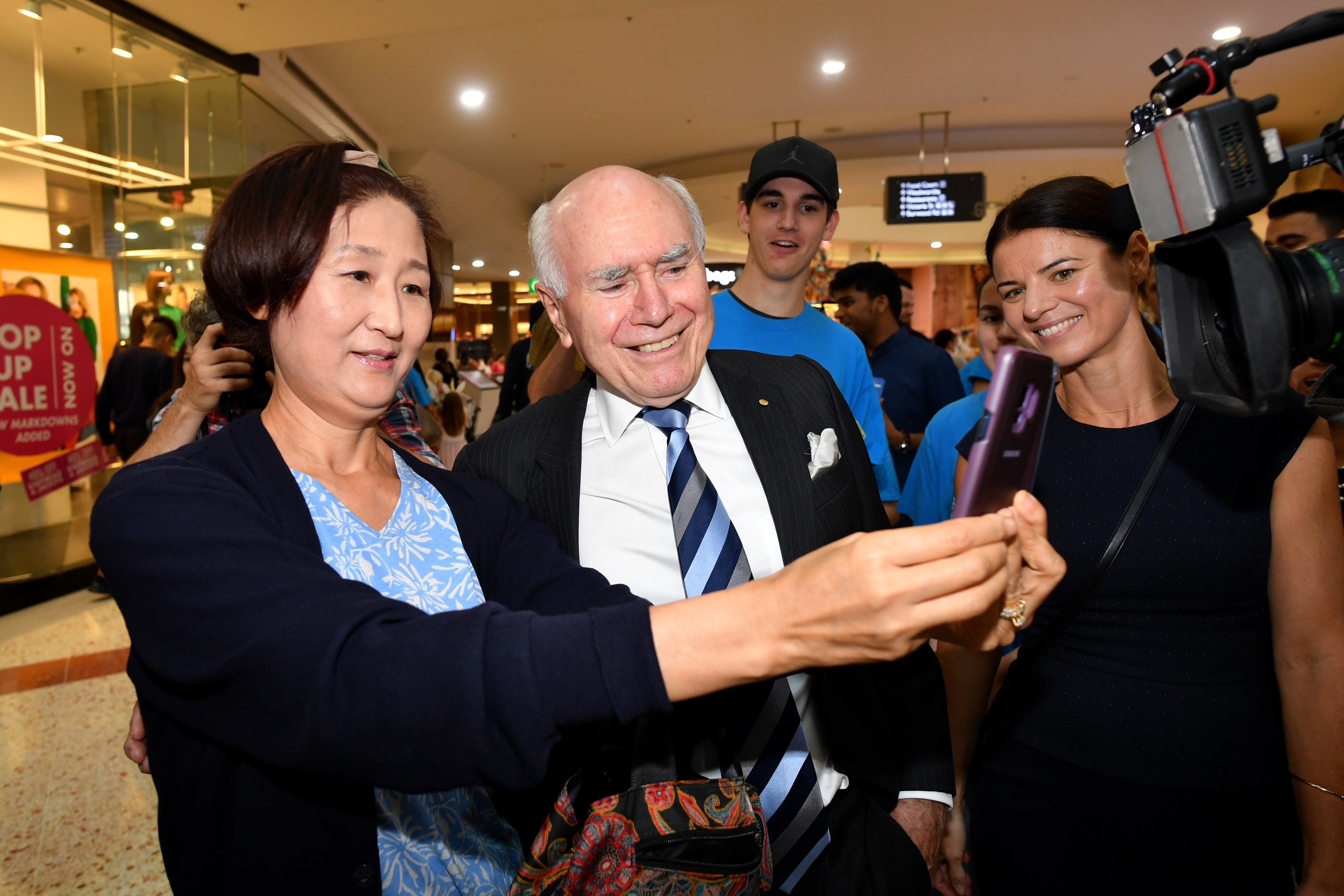 Former prime minister John Howard joins Liberal candidate for Reid Fiona Martin during a street walk at Burwood in Sydney, Tuesday, April 23, 2019. (AAP Image/Joel Carrett) NO ARCHIVING