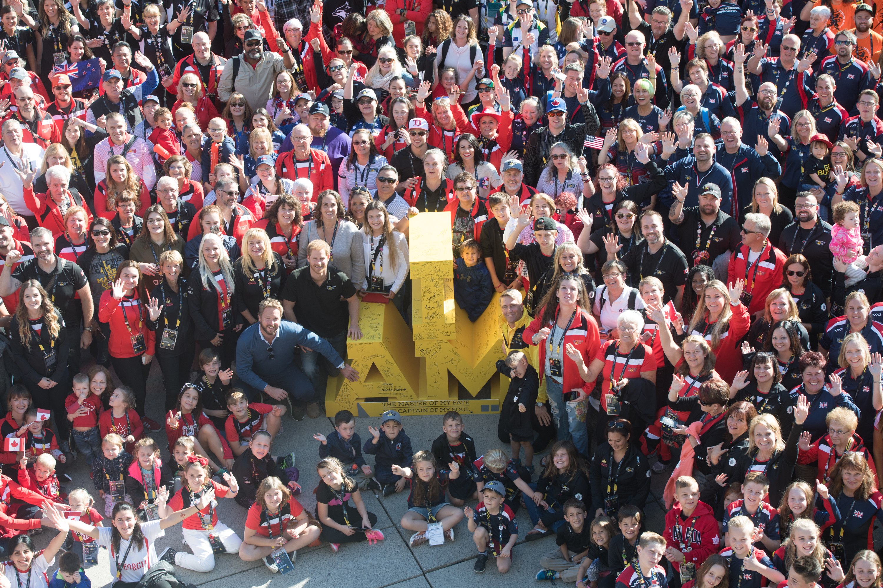 Prince Harry poses with family and friends of Invictus athletes in Toronto 2017