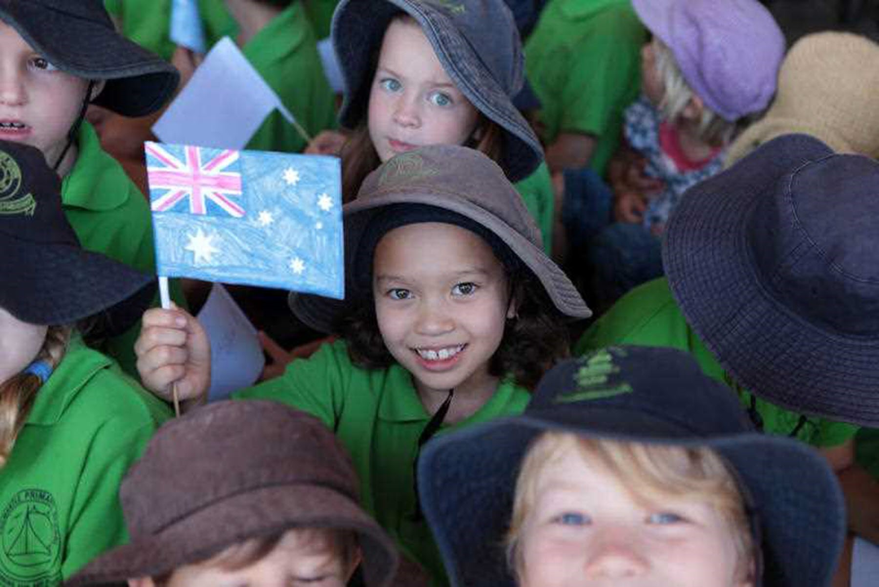 A child at a WA primary school with a flag (AAP)