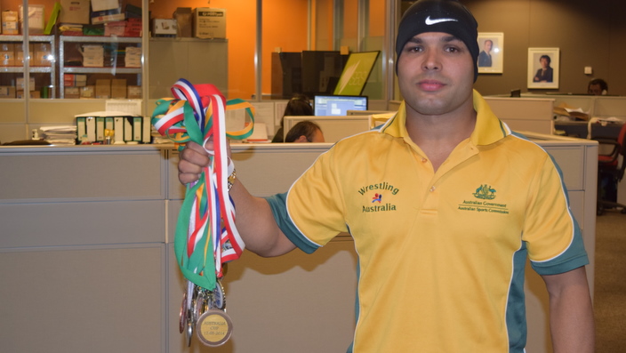 Vinod Kumar with his medals, at SBS Melbourne studio