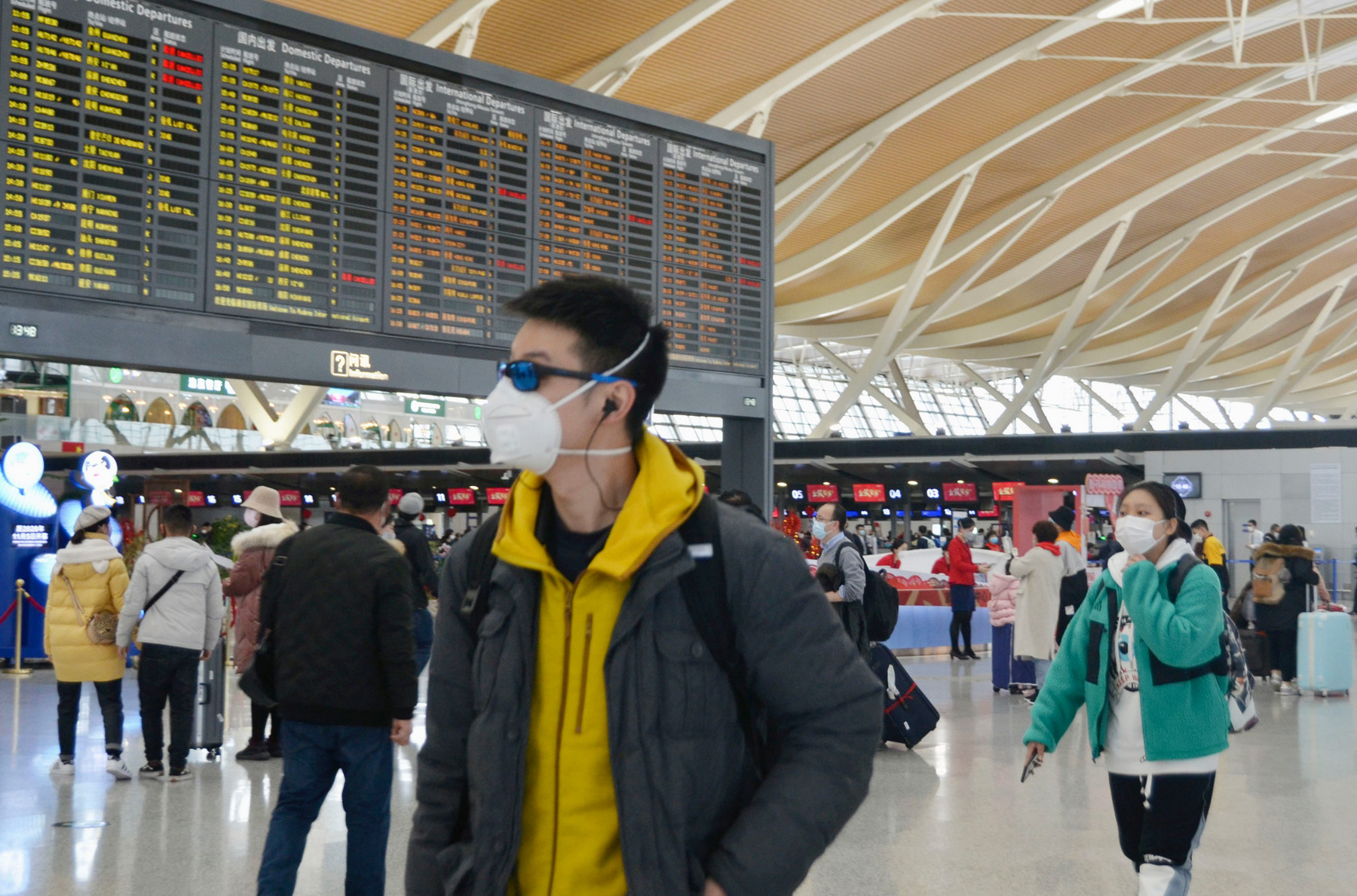 A man wears a mask at Shanghai Pudong International Airport on Jan. 26, 2020, amid the spread of pneumonia caused by a new coronavirus in the central Chinese city of Wuhan. (Kyodo via AP Images) ==Kyodo